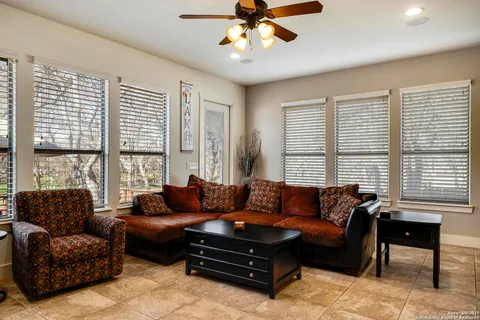 a living room with furniture and a large window