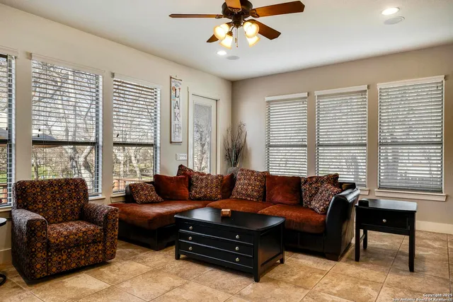 a living room with furniture and a large window