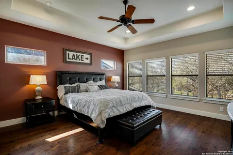 a spacious bedroom with a bed and a large window