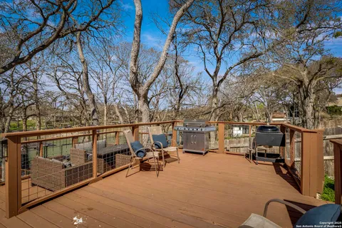 a view of a balcony with furniture