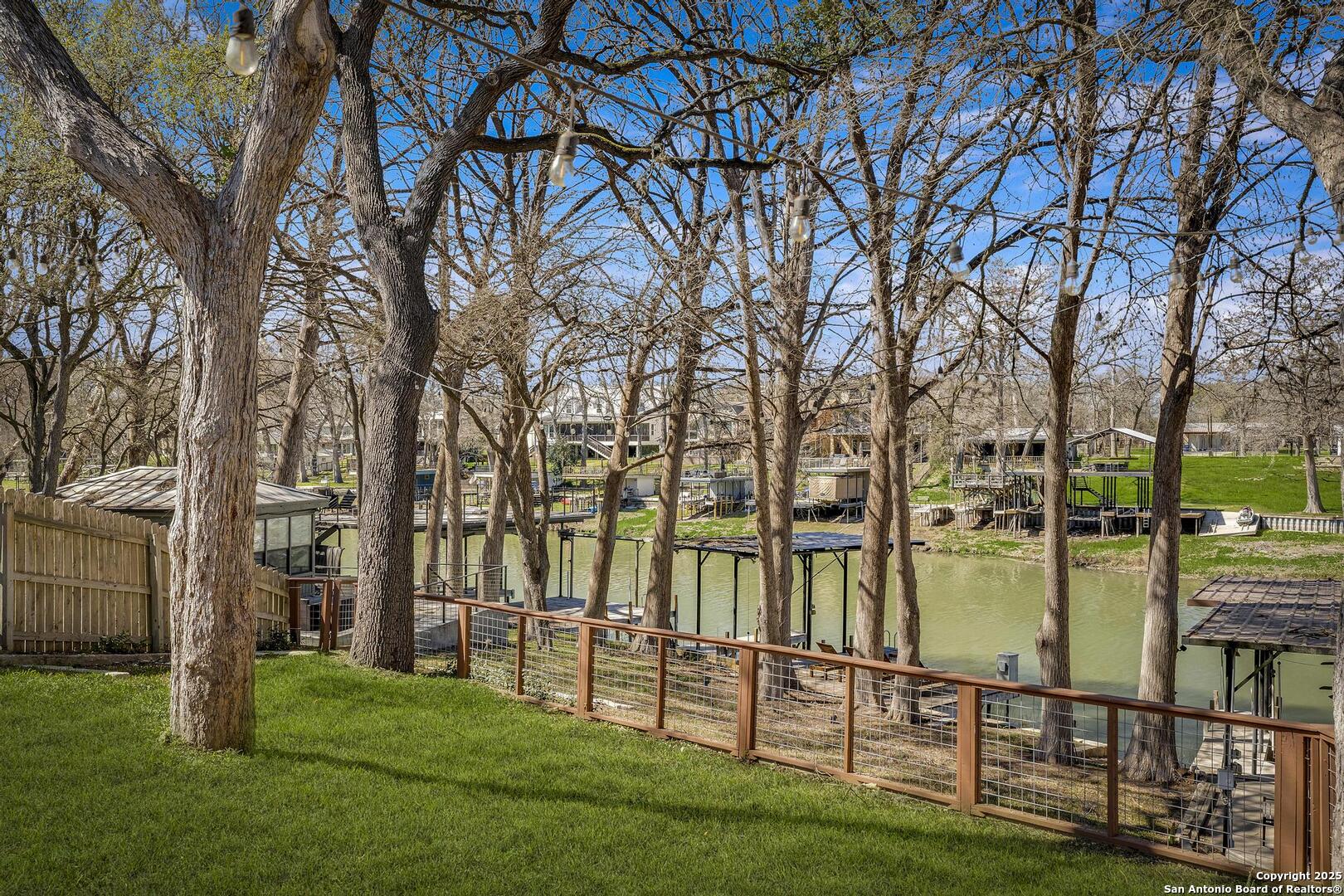 630 3 Oaks Road Seguin, TX 78155 - Photo 28 of 36 a view of a lake with houses