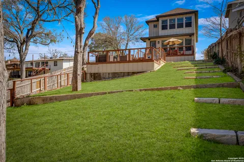a view of a backyard of the house