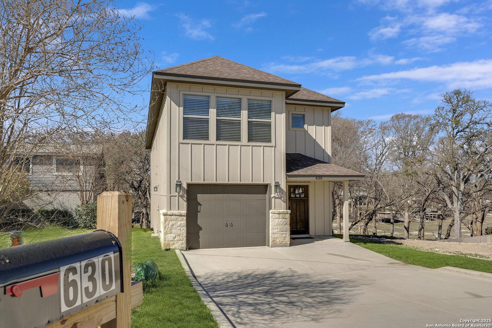 630 3 Oaks Road Seguin, TX 78155 - Photo 3 of 36 a front view of a house with a yard