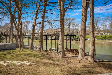 a view of a terrace with seating area and barbeque oven