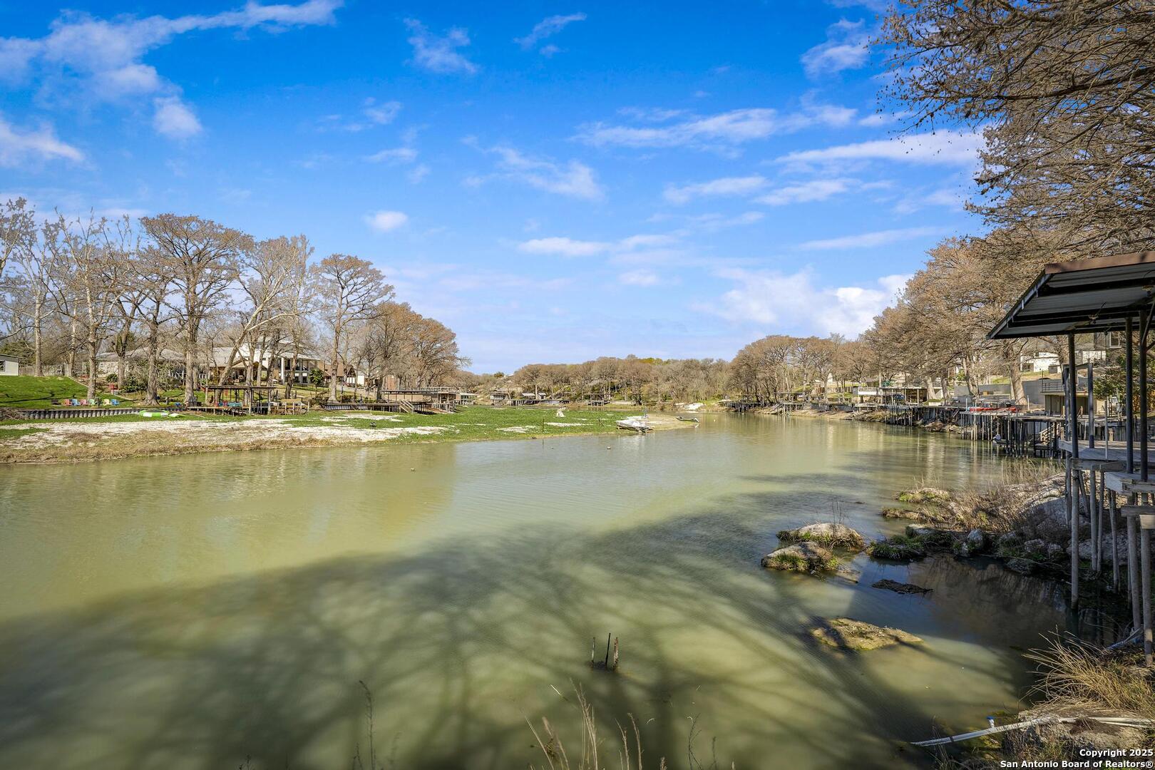 630 3 Oaks Road Seguin, TX 78155 - Photo 35 of 36 a view of a lake with houses