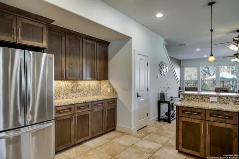 a kitchen with a sink and refrigerator