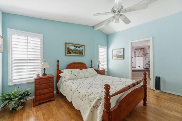 a bed room with a bed and a chandelier