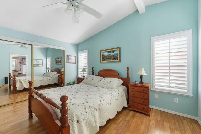 a bed room with a bed and a chandelier