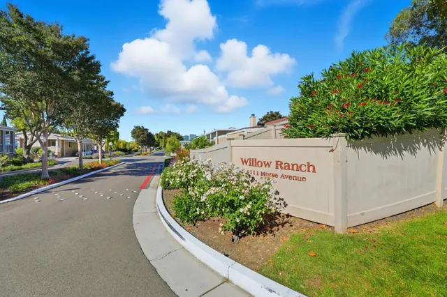 a view of a street with a building in the background