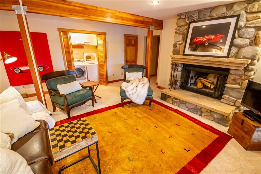 37 Wintergreen Circle Keystone, CO 80435 - Photo 16 of 35 a living room with furniture a rug and a fireplace