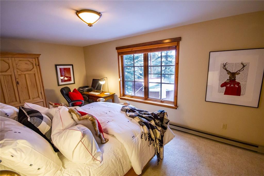 37 Wintergreen Circle Keystone, CO 80435 - Photo 20 of 35 a bed sitting in a bedroom next to a window