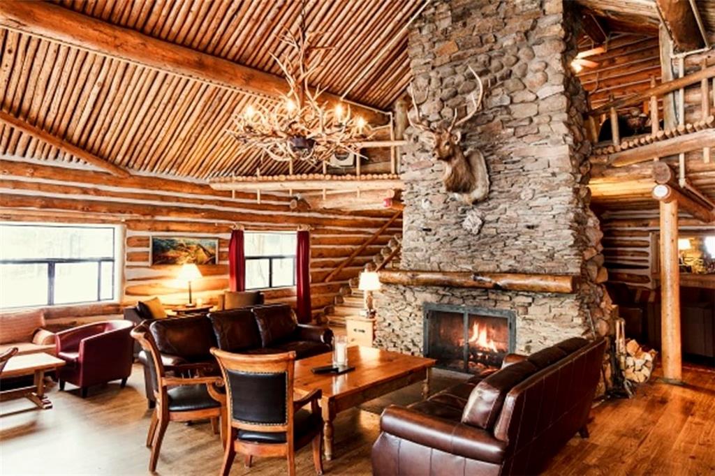 37 Wintergreen Circle Keystone, CO 80435 - Photo 33 of 35 a view of a patio with couches table and chairs and potted plants