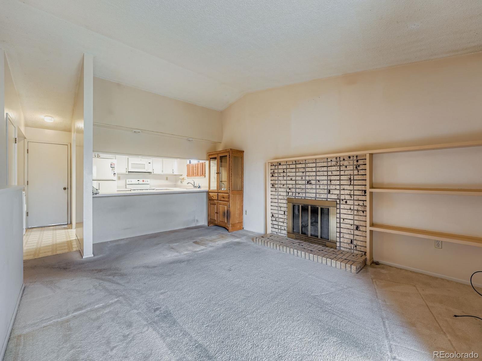 3447 South Norfolk Way Aurora, CO 80013 - Photo 8 of 14 a view of a livingroom with a fireplace