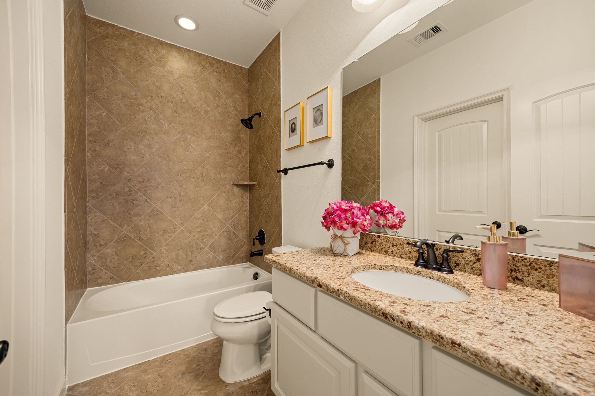 26515 Ashley Ridge Lane Katy, TX 77494 - Photo 33 of 50 a bathroom with a granite countertop sink mirror vanity bathtub and toilet