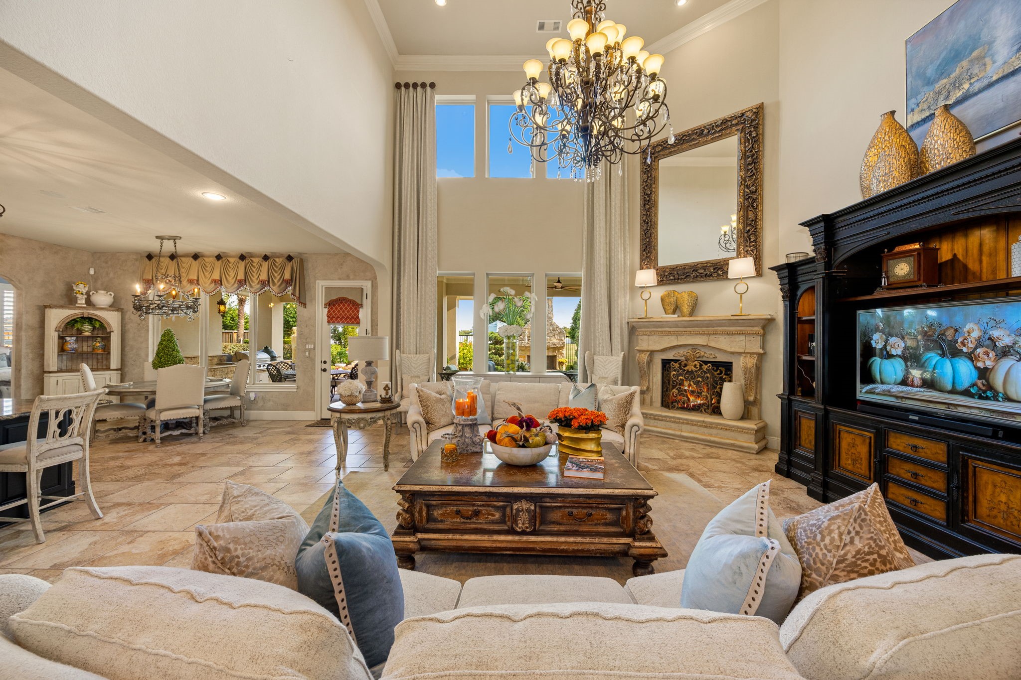 26515 Ashley Ridge Lane Katy, TX 77494 - Photo 9 of 50 a living room with furniture a chandelier and a fireplace