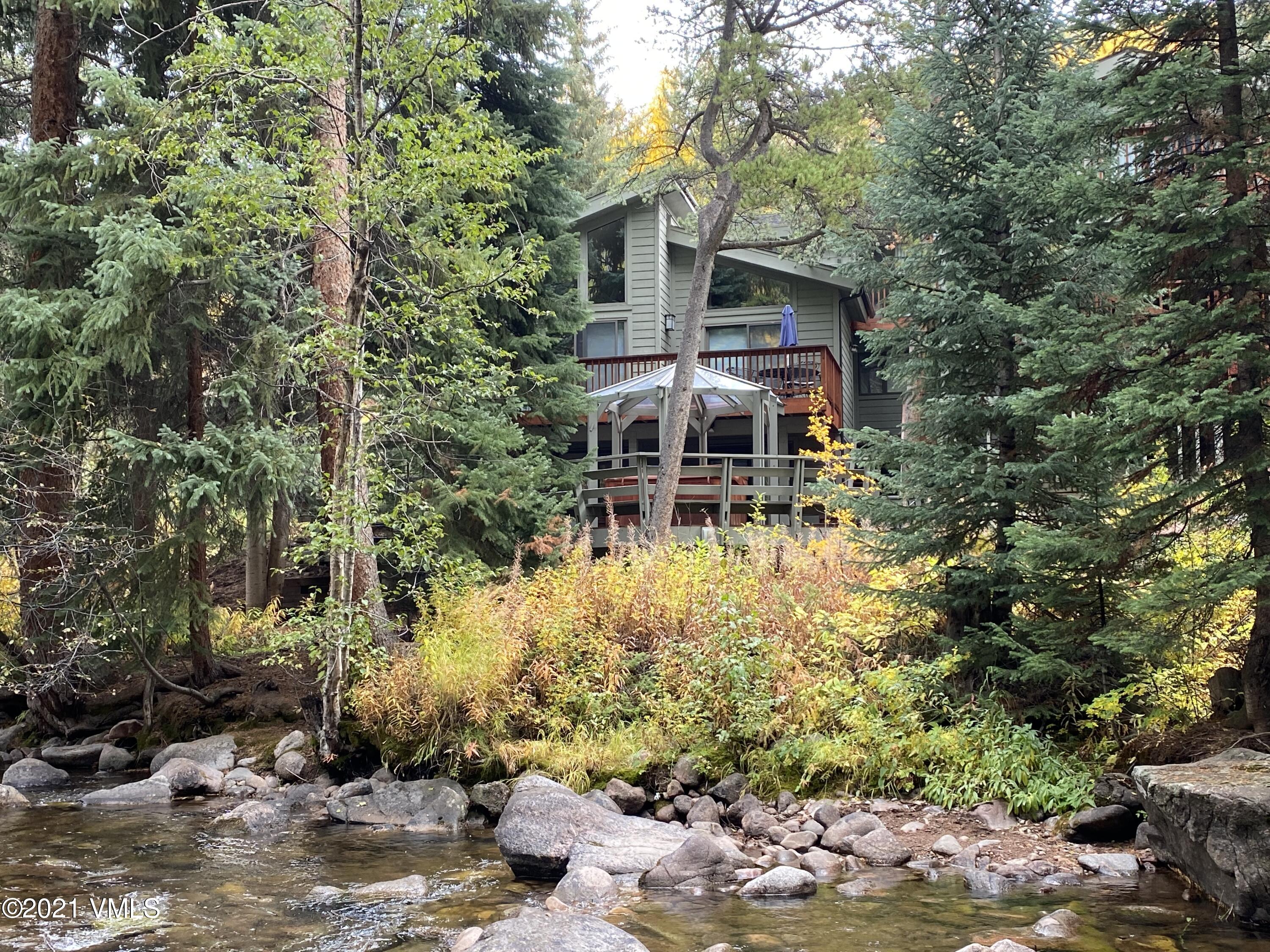 4484 Streamside Circle Vail, CO 81657 - Photo 1 of 29 front view of a house with a yard