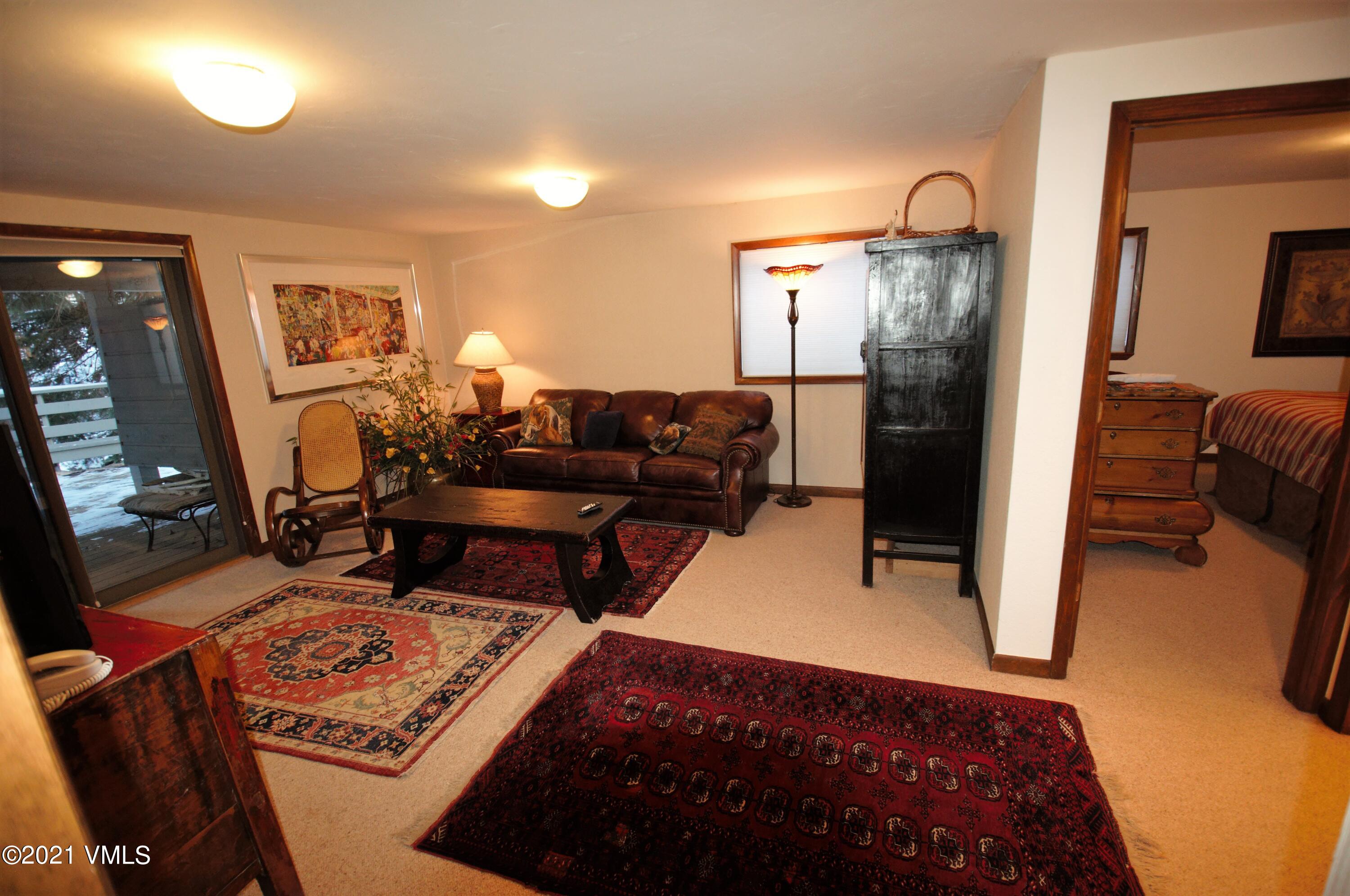 4484 Streamside Circle Vail, CO 81657 - Photo 11 of 29 a living room with furniture rug and window