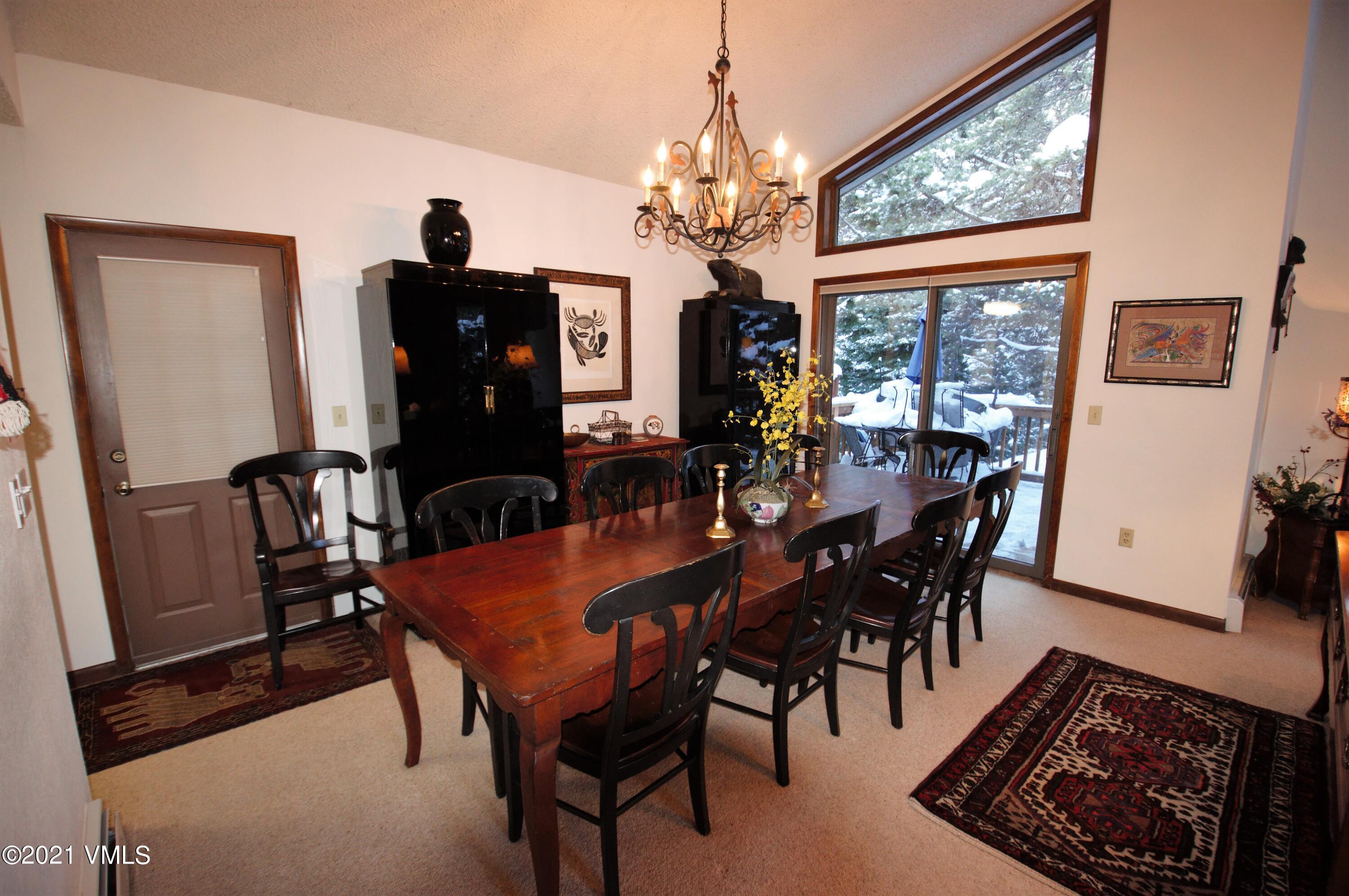 4484 Streamside Circle Vail, CO 81657 - Photo 19 of 29 a view of a dining room with furniture window and outside view