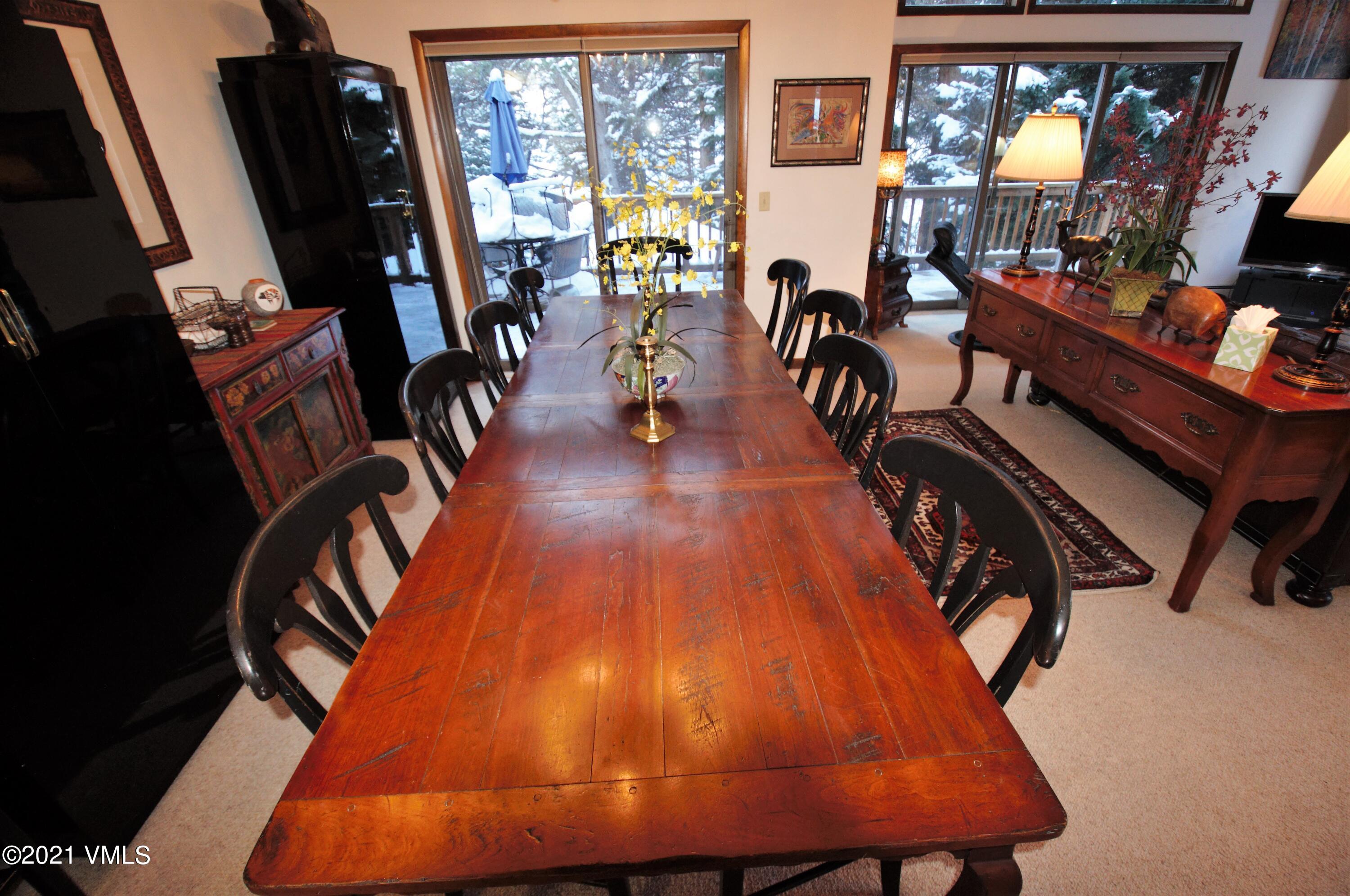 4484 Streamside Circle Vail, CO 81657 - Photo 20 of 29 wooden floor with dining table and chairs