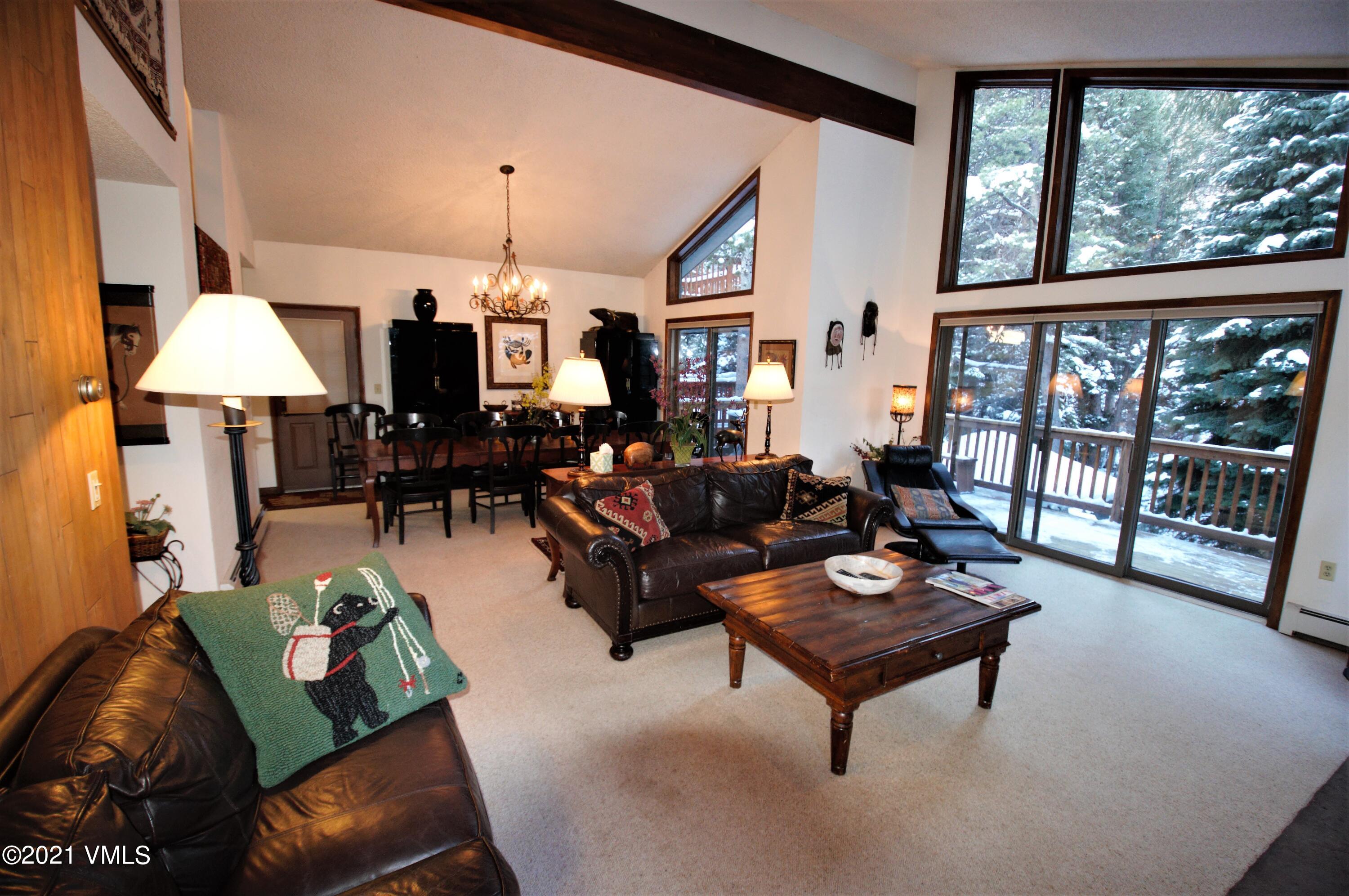 4484 Streamside Circle Vail, CO 81657 - Photo 21 of 29 a living room with furniture and a large window