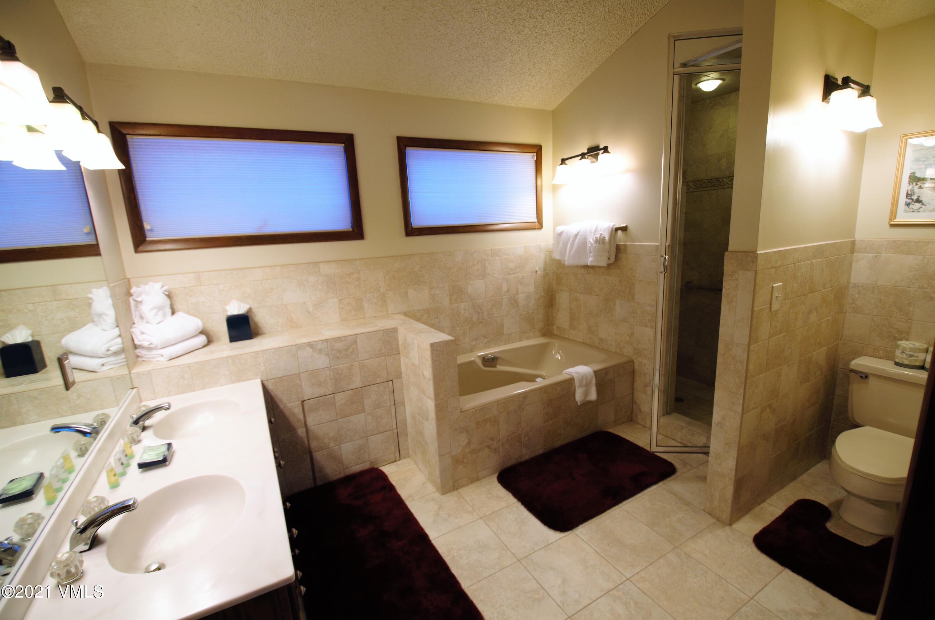 4484 Streamside Circle Vail, CO 81657 - Photo 25 of 29 a bathroom with a sink and a mirror