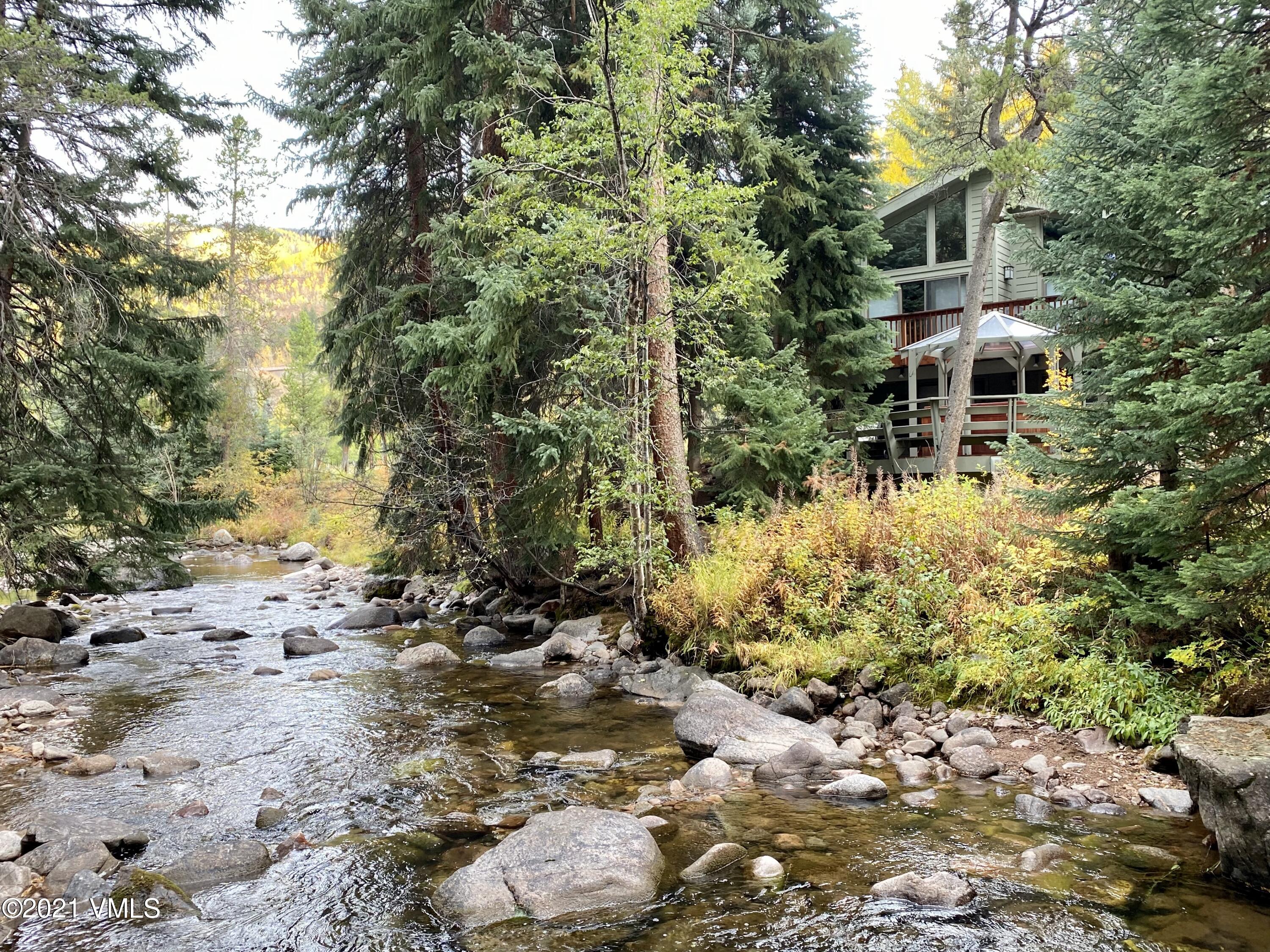 4484 Streamside Circle Vail, CO 81657 - Photo 29 of 29 a front view of a house with a yard