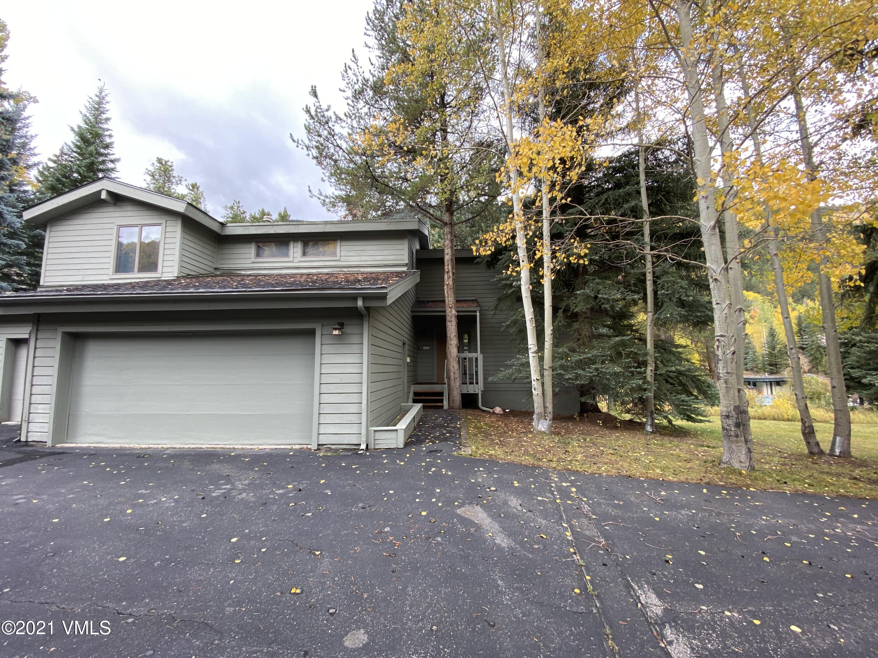 4484 Streamside Circle Vail, CO 81657 - Photo 3 of 29 a house with trees in front of it