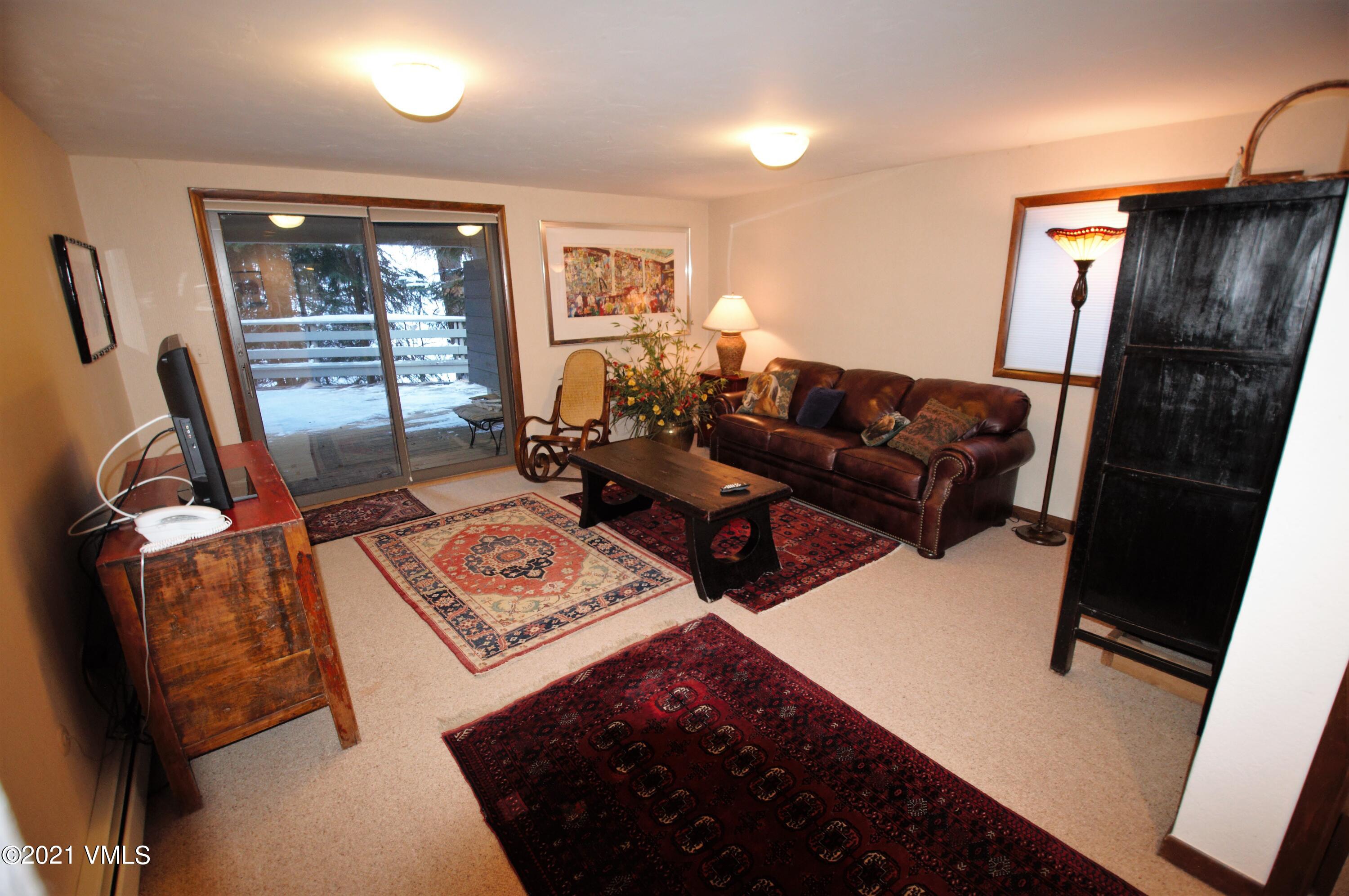 4484 Streamside Circle Vail, CO 81657 - Photo 10 of 29 a living room with furniture and a window