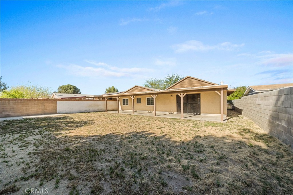 37310 Populus Avenue Palmdale, CA 93552 - Photo 27 of 28 a front view of a house with a yard