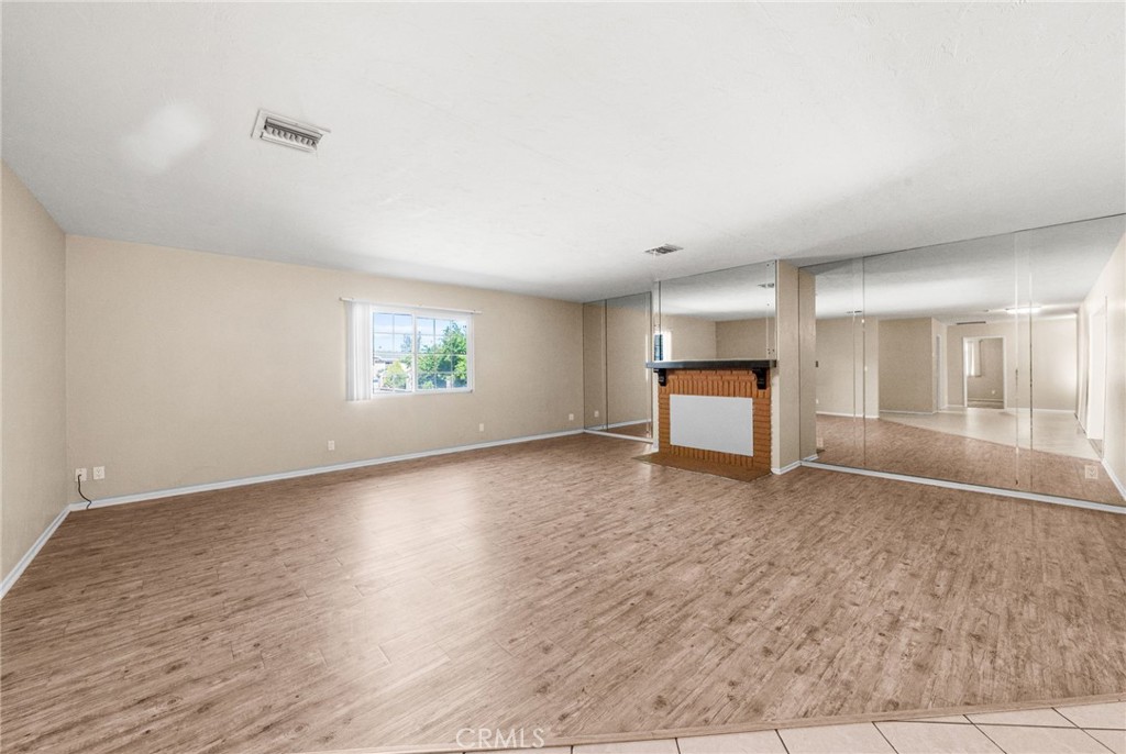 37310 Populus Avenue Palmdale, CA 93552 - Photo 5 of 28 an empty room with windows and mountain view