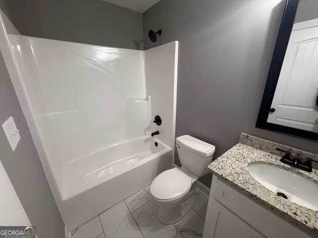 a view of a livingroom with wooden floor