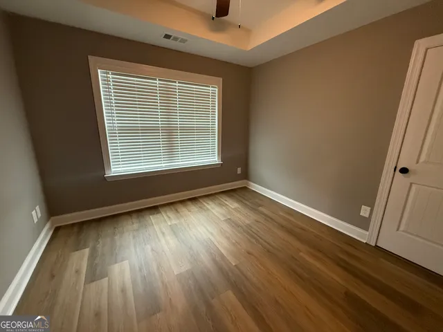 a bathroom with double sink and a mirror