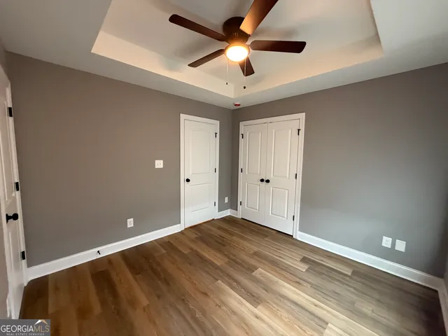 a bathroom with a glass shower door and a window
