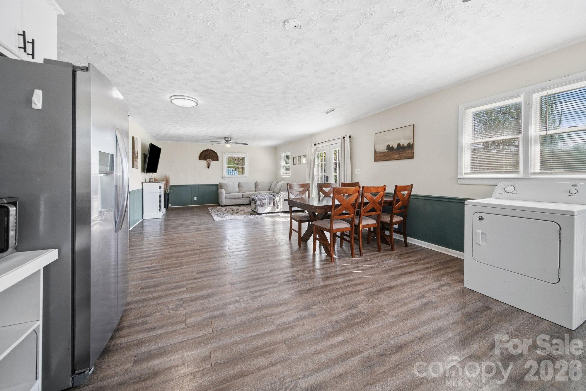 197 Vineyard Road Norwood, NC 28128 - Photo 12 of 27 a view of a dining room with furniture and wooden floor