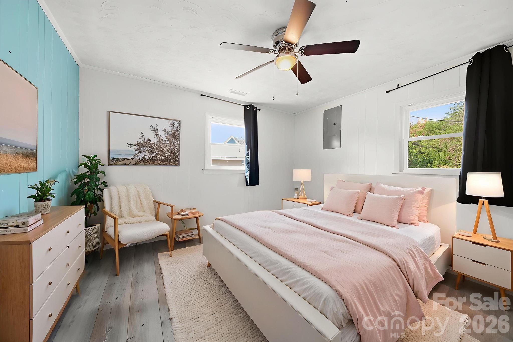 197 Vineyard Road Norwood, NC 28128 - Photo 18 of 27 a bedroom with a bed couch and window