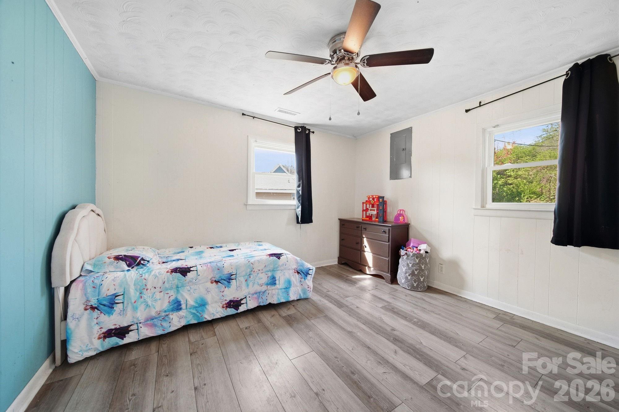 197 Vineyard Road Norwood, NC 28128 - Photo 20 of 27 a bedroom with bed and wooden floor