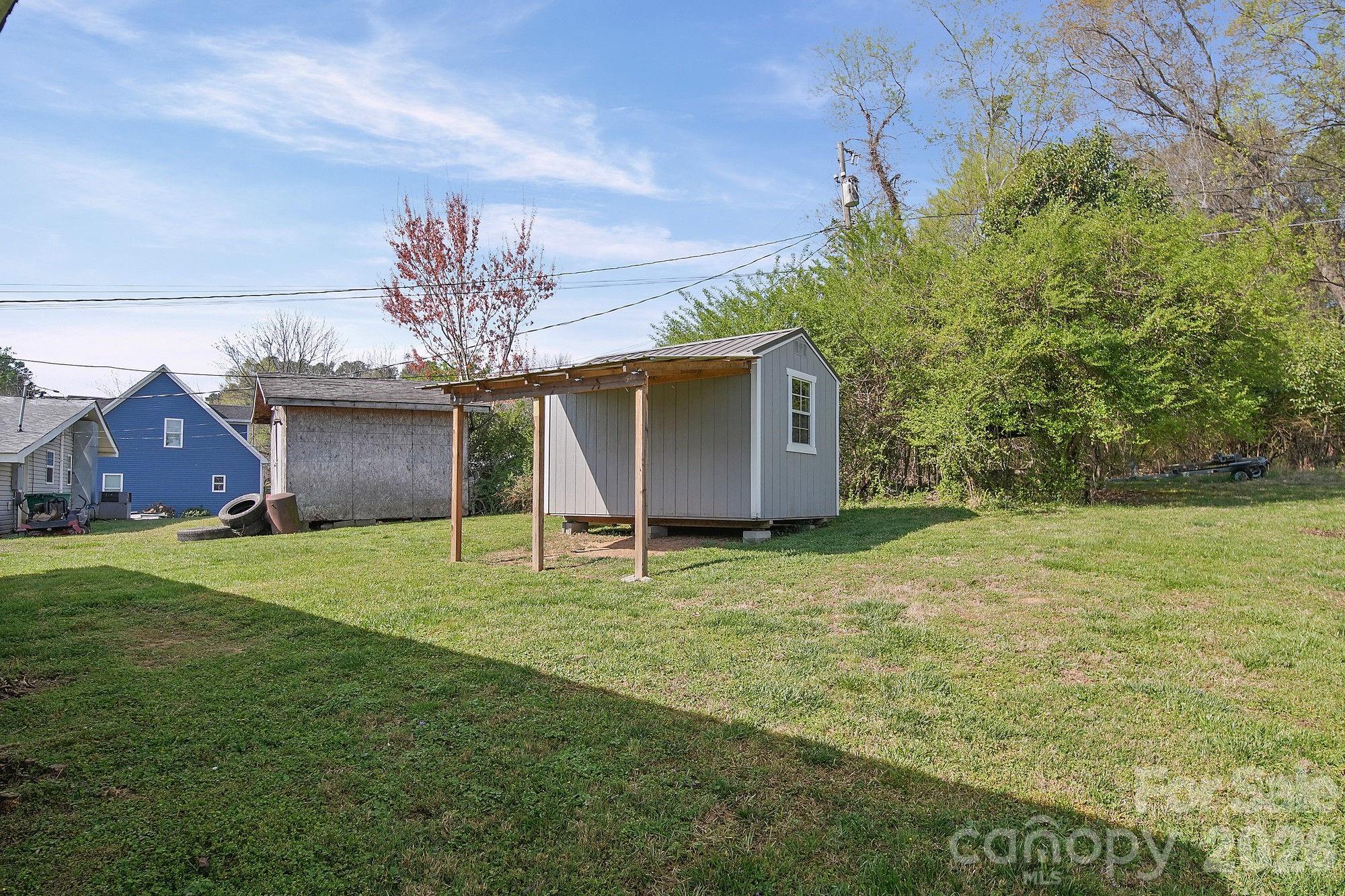 197 Vineyard Road Norwood, NC 28128 - Photo 25 of 27 a house with a outdoor space