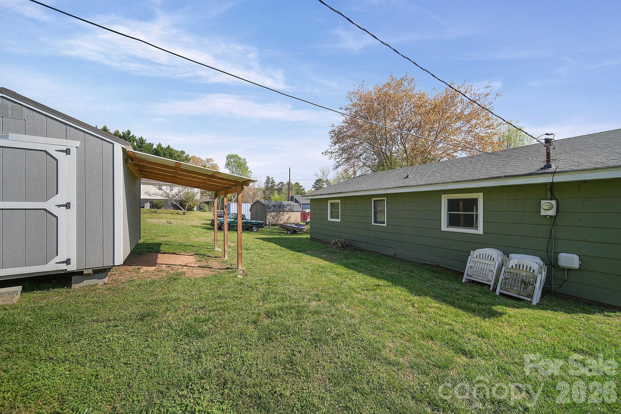197 Vineyard Road Norwood, NC 28128 - Photo 26 of 27 a view of a house with backyard