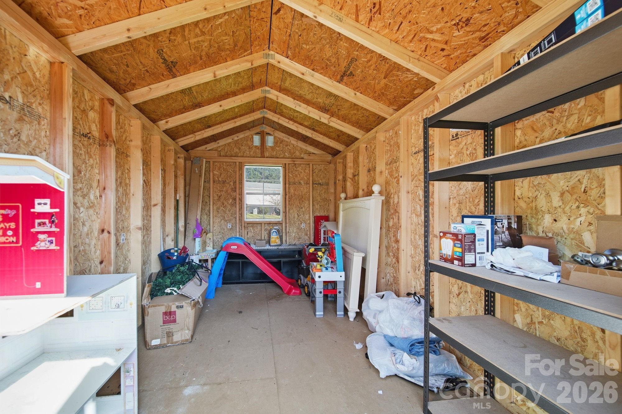 197 Vineyard Road Norwood, NC 28128 - Photo 27 of 27 a living room with furniture and a floor to ceiling window