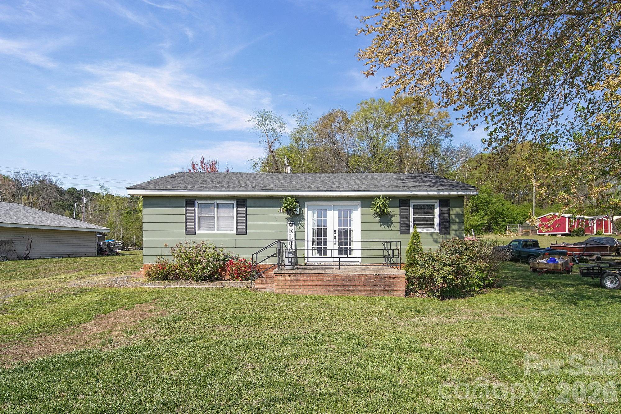 197 Vineyard Road Norwood, NC 28128 - Photo 4 of 27 front view of a house with a yard