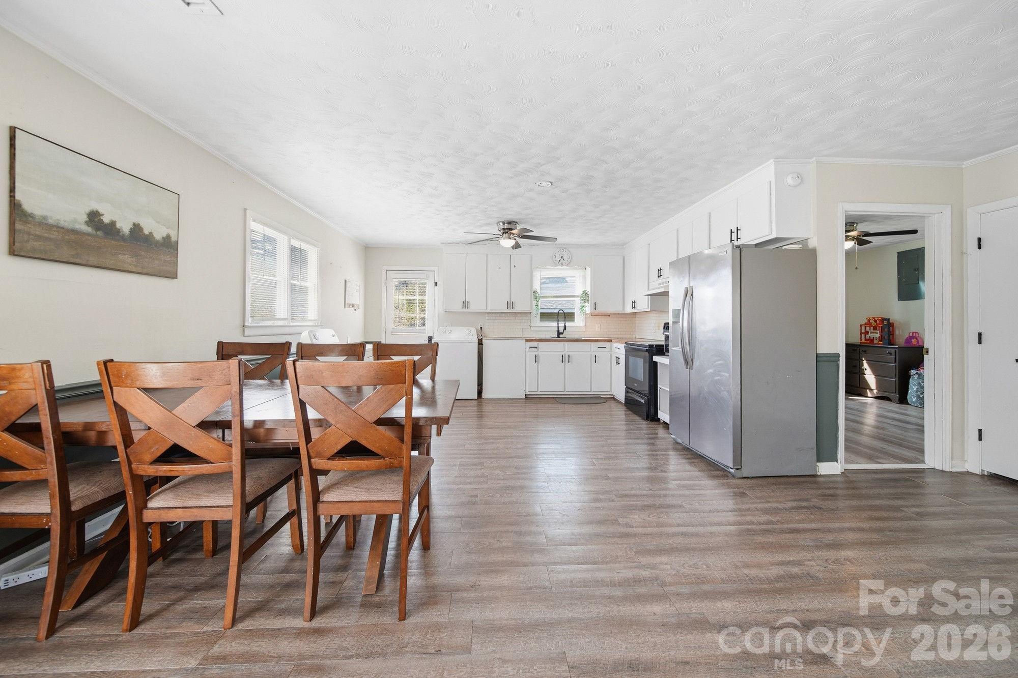 197 Vineyard Road Norwood, NC 28128 - Photo 9 of 27 a view of a dining room with furniture and wooden floor