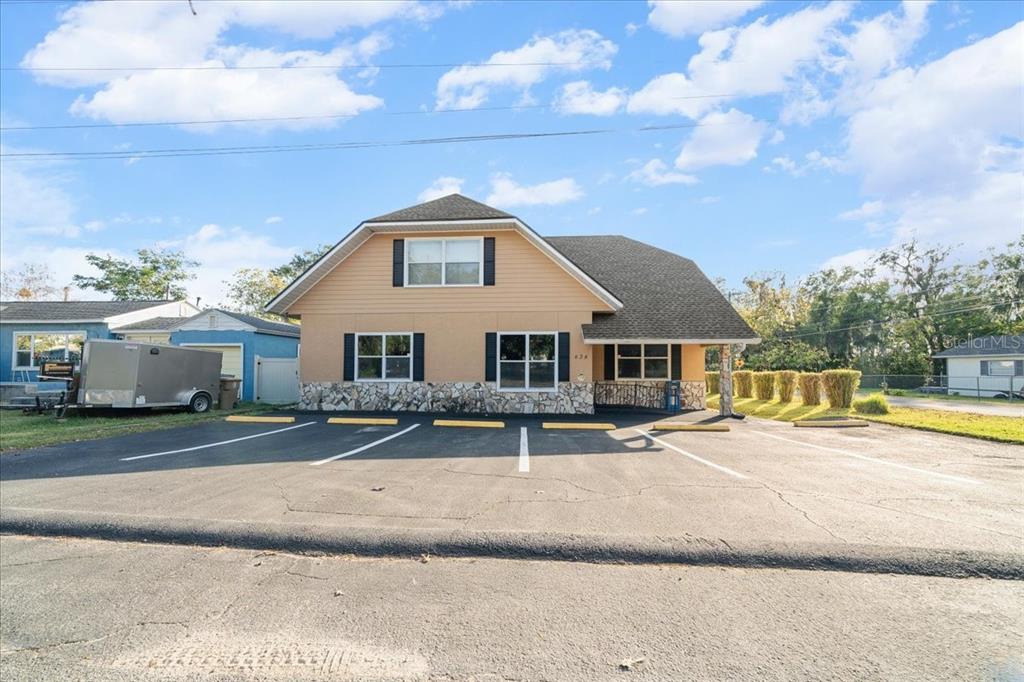 434 Southwest 14th Street, Unit A Ocala, FL 34471 - Photo 11 of 100 a front view of a house with a yard