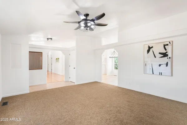 a view of a livingroom with a ceiling fan
