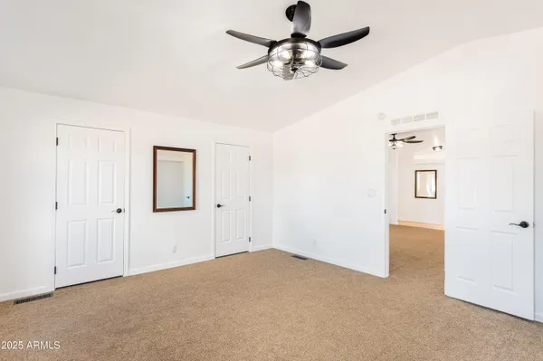 a view of a livingroom with a ceiling fan