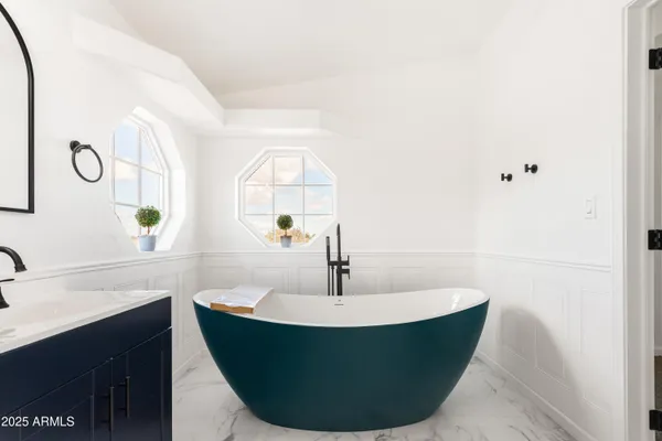 a white bath tub sitting in a bathroom