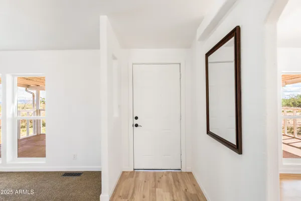 a view of front door with hallway