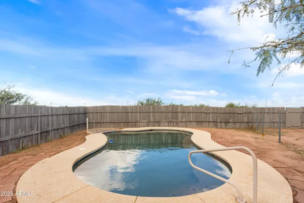 a view of a swimming pool with a terrace