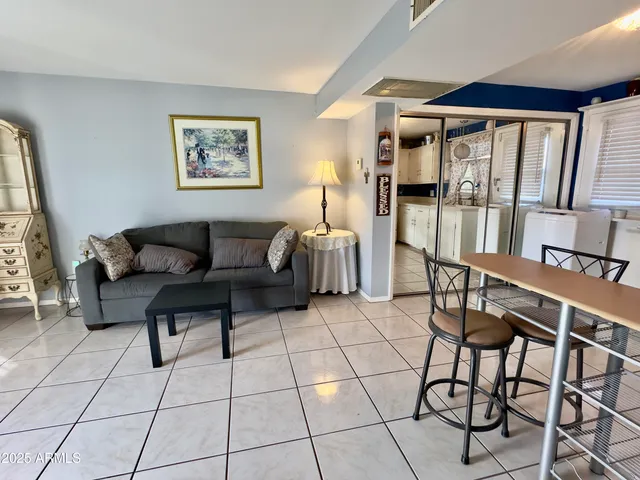 a living room with furniture and a window