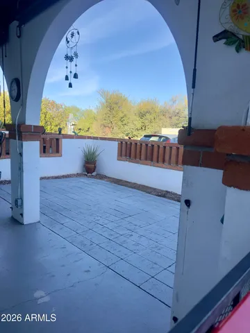 a view of balcony with furniture