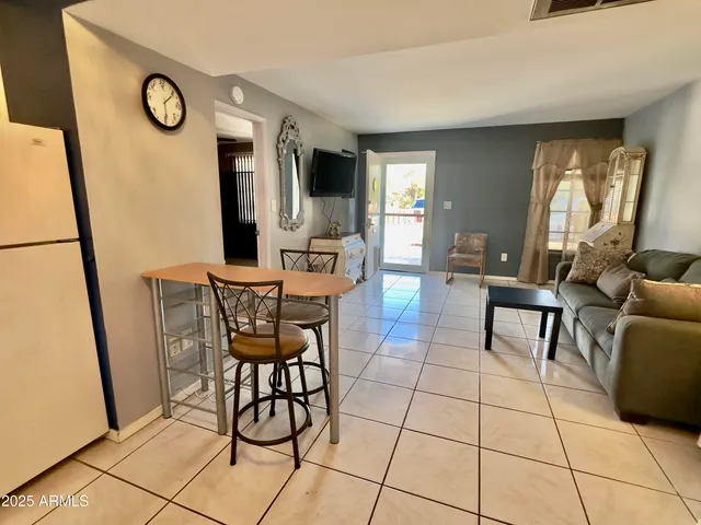 a view of a livingroom with furniture and window